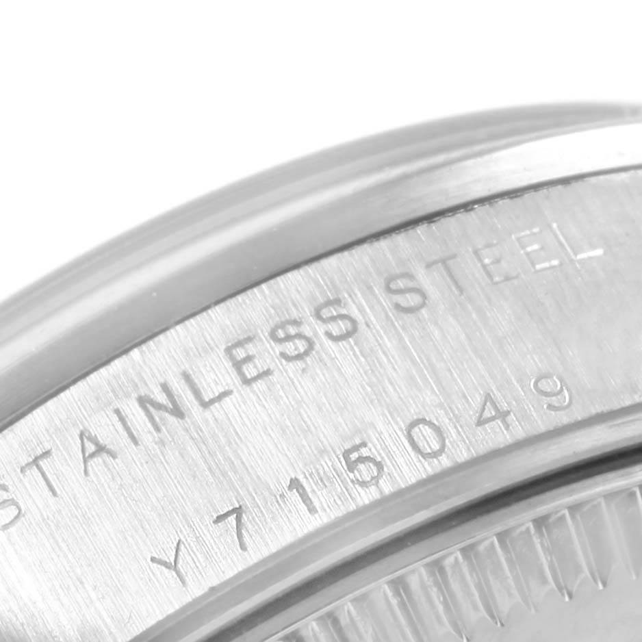 The image shows a close-up angle of the side case featuring the serial number and "STAINLESS STEEL" inscription of a Rolex Mid-Size 78240 Women's Stainless Steel Silver Dial 78240 Women's Stainless Steel Silver Dial watch.