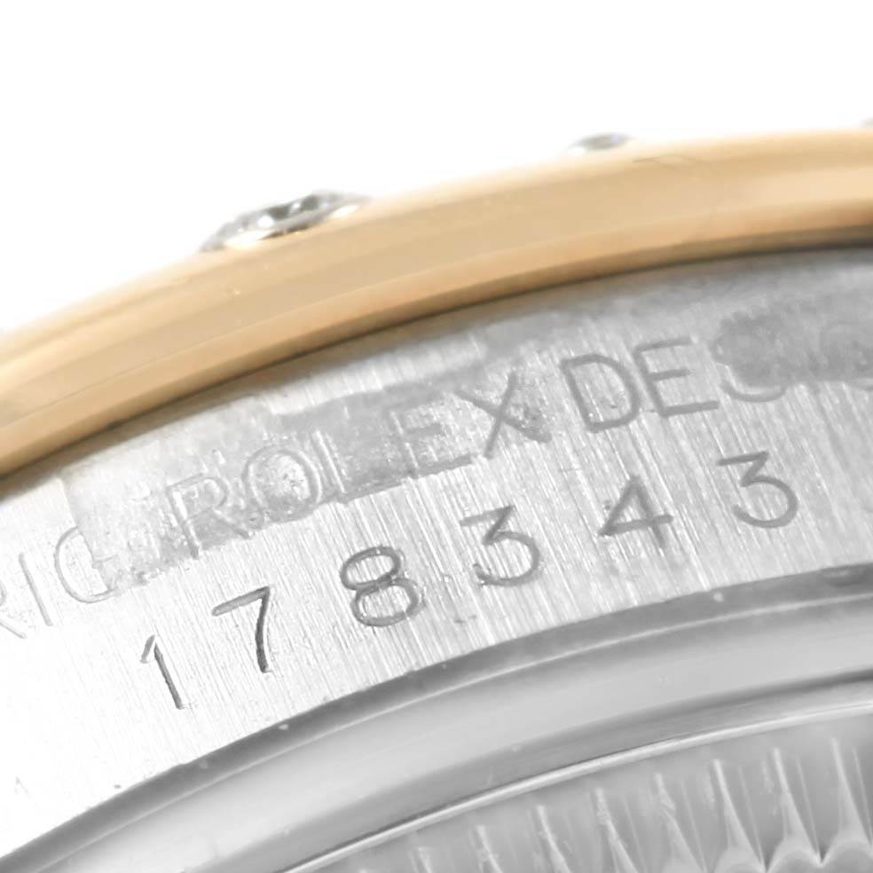 The image shows a close-up of the serial number engraving on the side of a Rolex Mid-Size 178343 Women's Steel and Gold (two tone) Mother of Pearl Dial 178343 Women's Steel and Gold (two tone) Mother of Pearl Dial watch case.