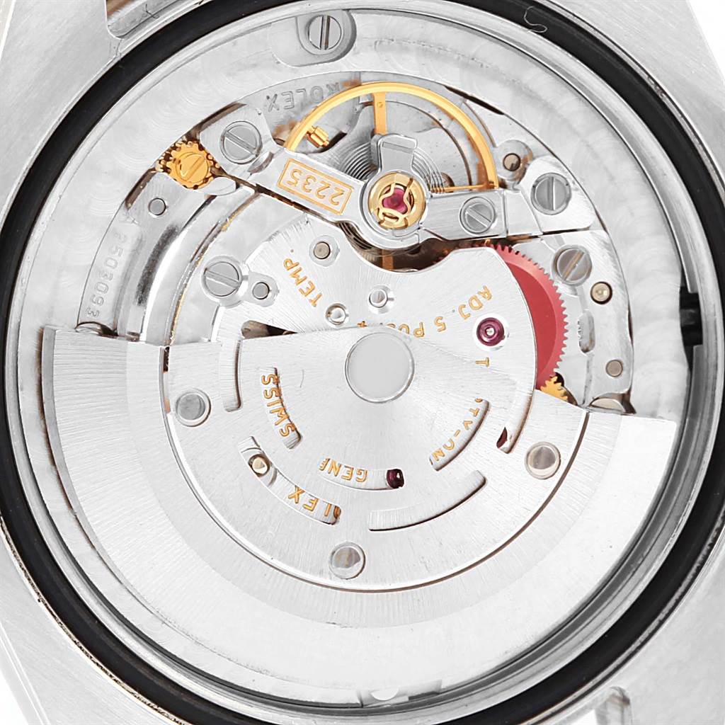 This image shows the movement and internal mechanics of a Mid-Size Rolex watch, viewed from the back.
