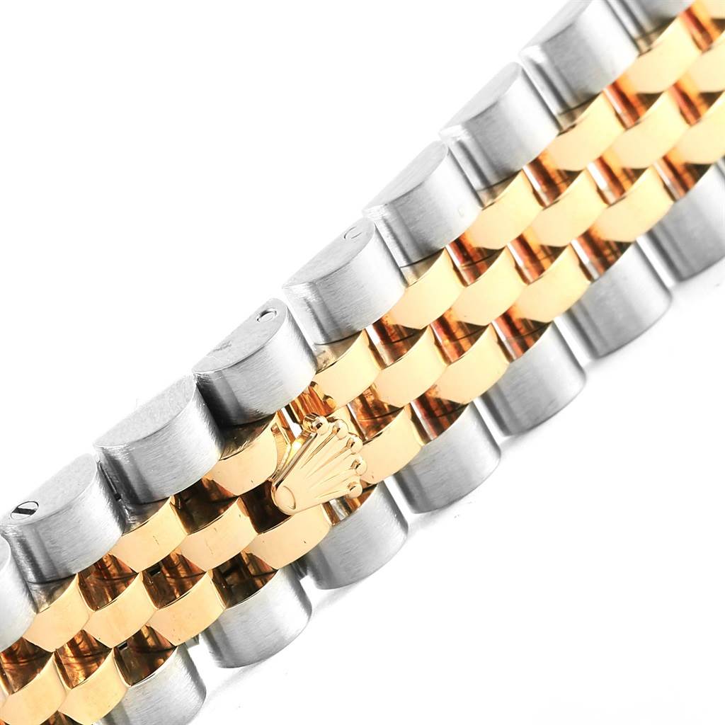 This image shows a close-up of the two-tone metal bracelet of a Mid-Size Rolex watch.