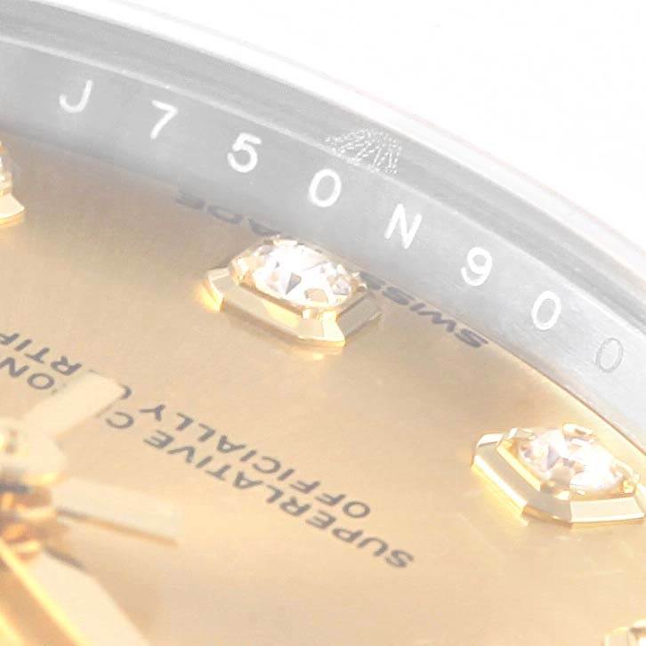 This close-up angle shows the bezel and part of the dial with diamond markers of the Rolex Mid-Size 178343 Women's Steel and Gold (two tone) Champagne Dial 178343 Women's Steel and Gold (two tone) Champagne Dial model watch.