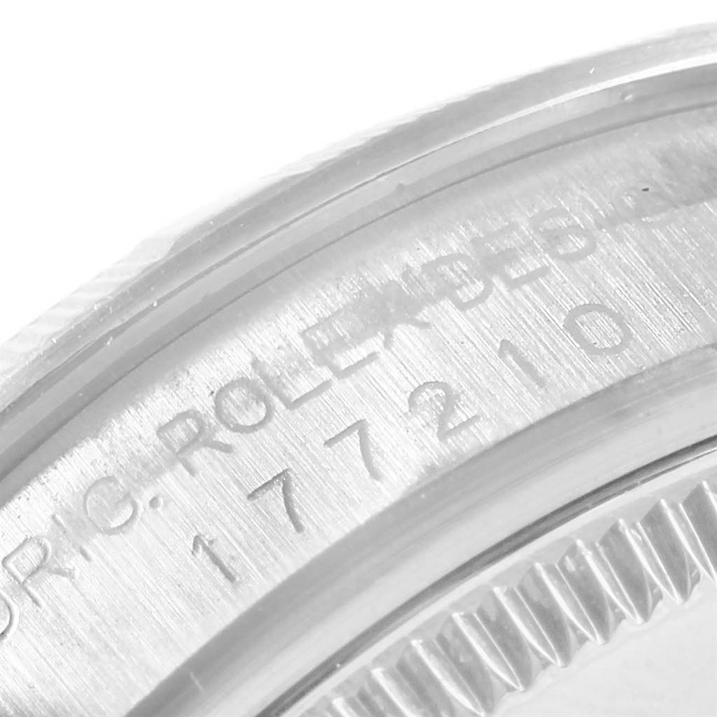 This image shows the engraved serial number on the side of the bezel of a Mid-Size Rolex watch.