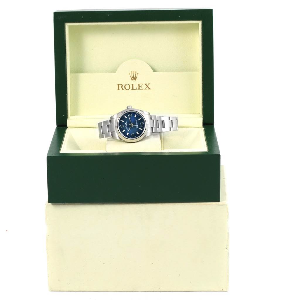 The Rolex Mid-Size 177210 Women's Stainless Steel Blue Dial 177210 Women's Stainless Steel Blue Dial watch is displayed front-on in its green and cream box.