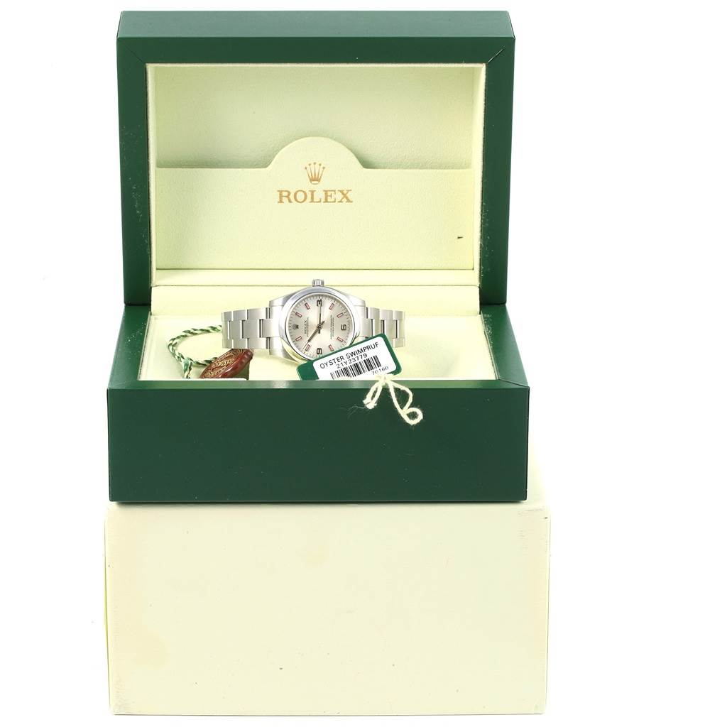 The Rolex Mid-Size 177200 Women's Stainless Steel Silver Dial 177200 Women's Stainless Steel Silver Dial watch is displayed in an open green box, showing the watch face, bracelet, and hang tags.