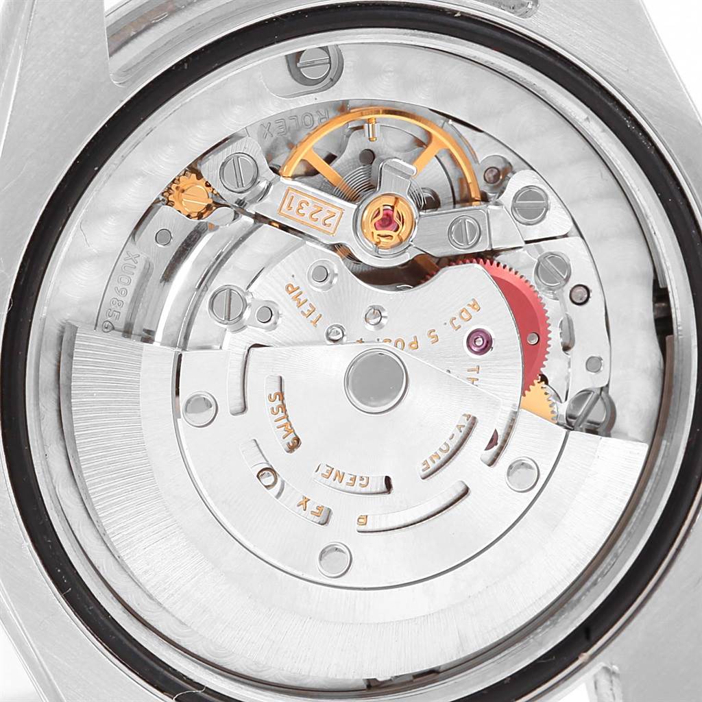 This is a close-up view of the movement mechanism inside a Mid-Size Rolex watch.