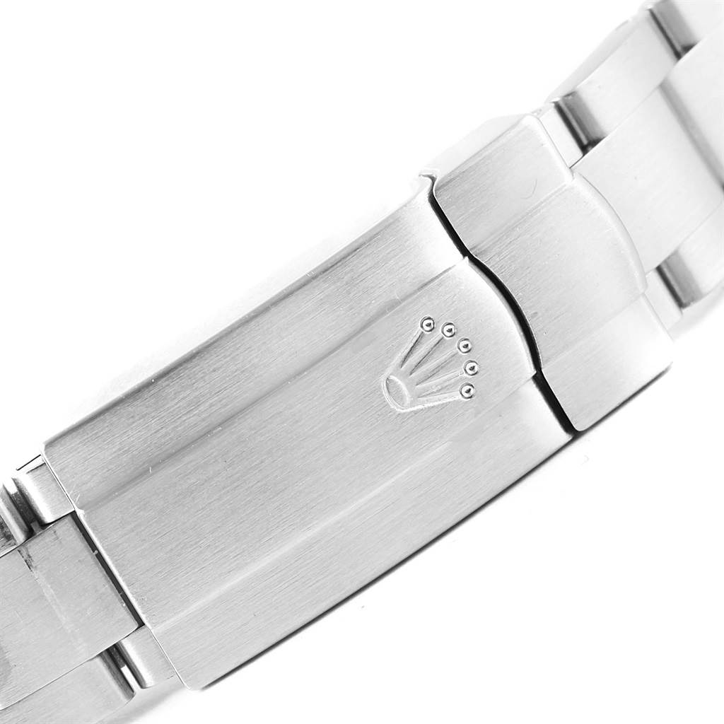 The image shows the clasp of a Rolex Mid-Size 177200 Women's Stainless Steel Silver Dial 177200 Women's Stainless Steel Silver Dial model watch, featuring the brand's logo engraved on it.