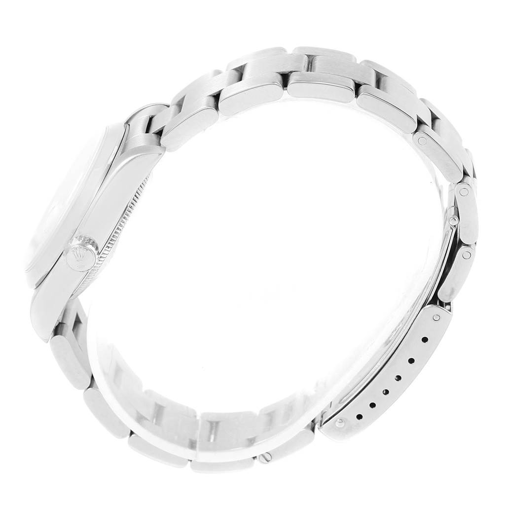 This image shows a side view of the case and bracelet of a Rolex Mid-Size 68240 Women's Stainless Steel White Dial 68240 Women's Stainless Steel White Dial watch.