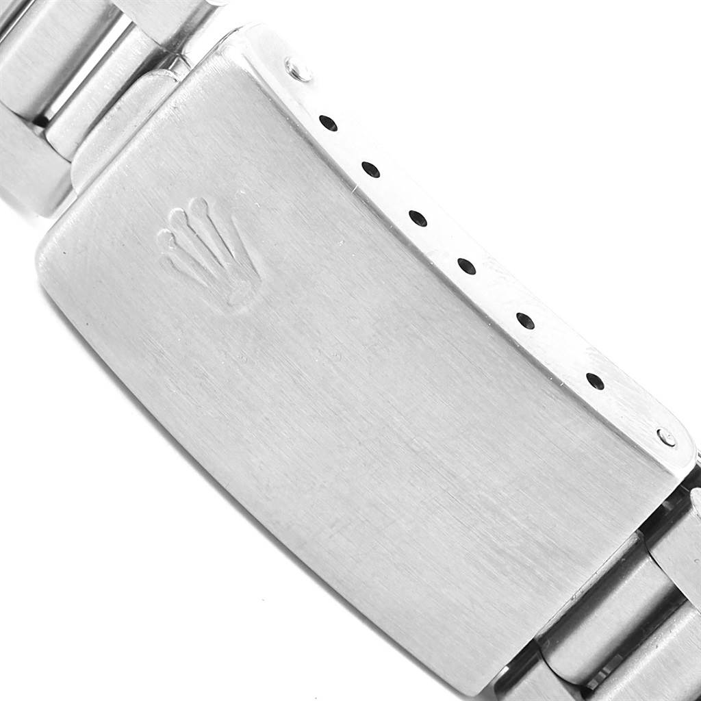 The image shows the clasp of a Rolex Mid-Size 68240 Women's Stainless Steel White Dial 68240 Women's Stainless Steel White Dial watch from a close-up angle.