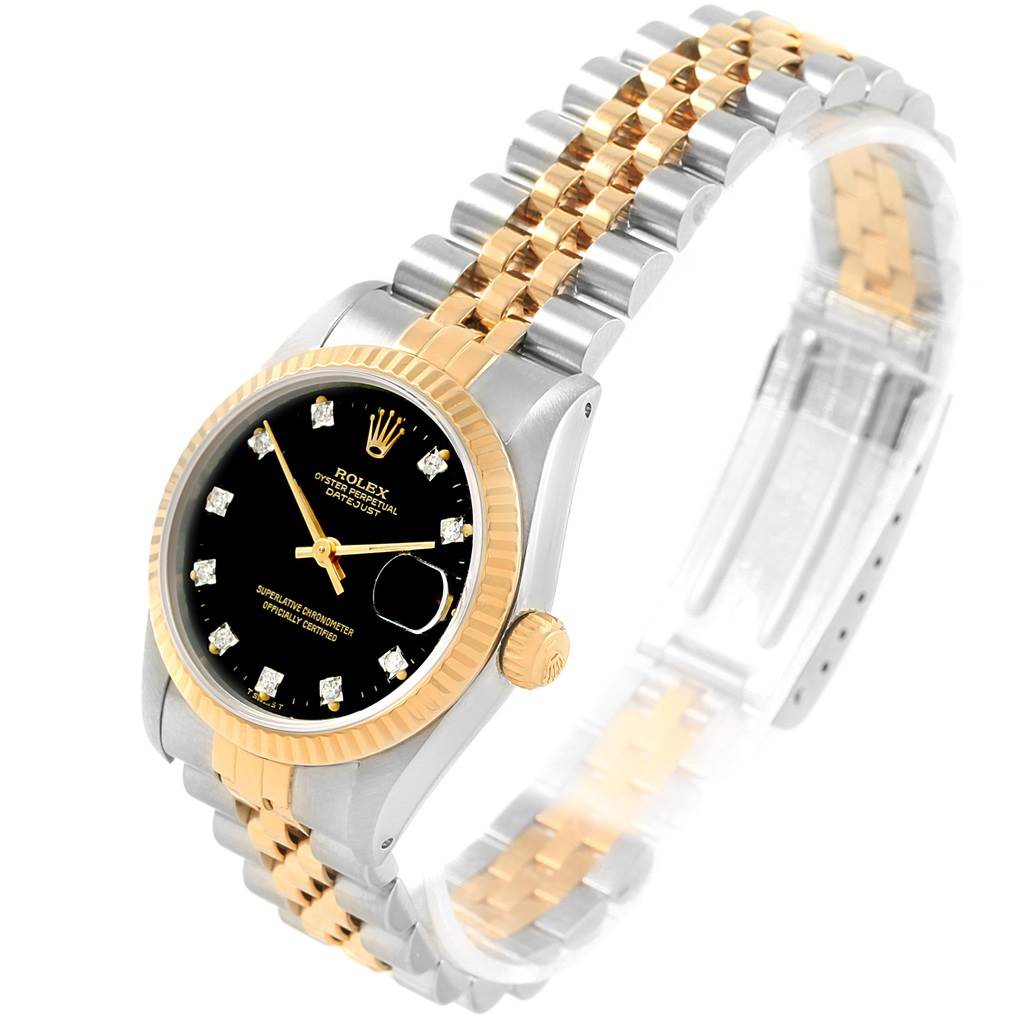 This image shows a side angle view of a Rolex Mid-Size 68273 Women's Steel and Gold (two tone) Black Dial 68273 Women's Steel and Gold (two tone) Black Dial model, focusing on the dial, bezel, and part of the two-tone bracelet.