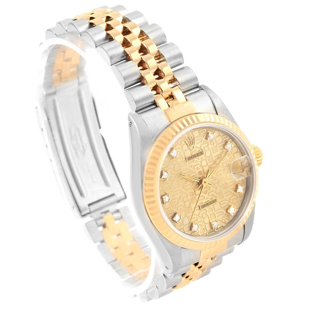 This angled view of the Rolex Mid-Size 68273 Women's Steel and Gold (two tone) Champagne Dial 68273 Women's Steel and Gold (two tone) Champagne Dial watch showcases the face, bezel, and two-tone bracelet.