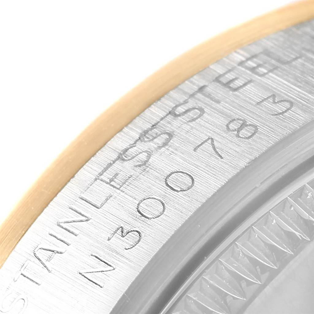 The image shows a close-up of the bezel and engraved serial details of a Rolex Mid-Size 68273 Women's Steel and Gold (two tone) Champagne Dial 68273 Women's Steel and Gold (two tone) Champagne Dial model watch.