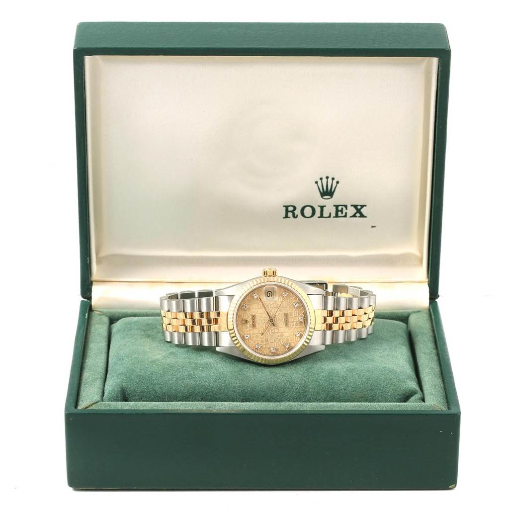 The Rolex Mid-Size 68273 Women's Steel and Gold (two tone) Champagne Dial 68273 Women's Steel and Gold (two tone) Champagne Dial watch is displayed face-up in an open green box with a metal and gold bracelet visible.