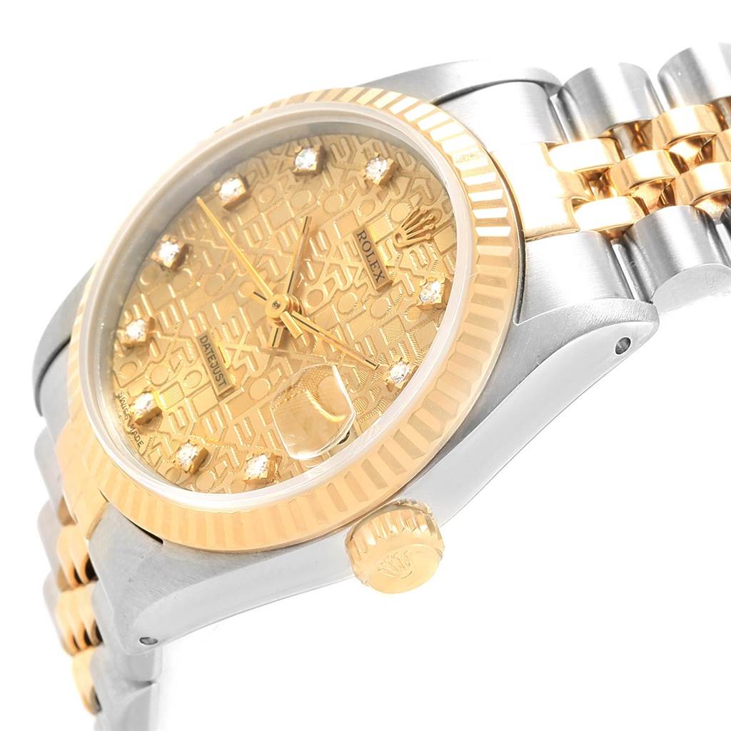 This image shows a side angle of a mid-size Rolex watch, featuring its gold and stainless steel case, bezel, crown, and part of the bracelet.