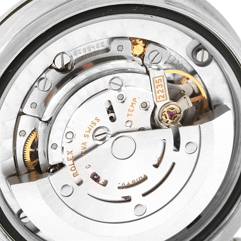 This image shows a close-up view of the movement mechanism and components of a Mid-Size Rolex watch.