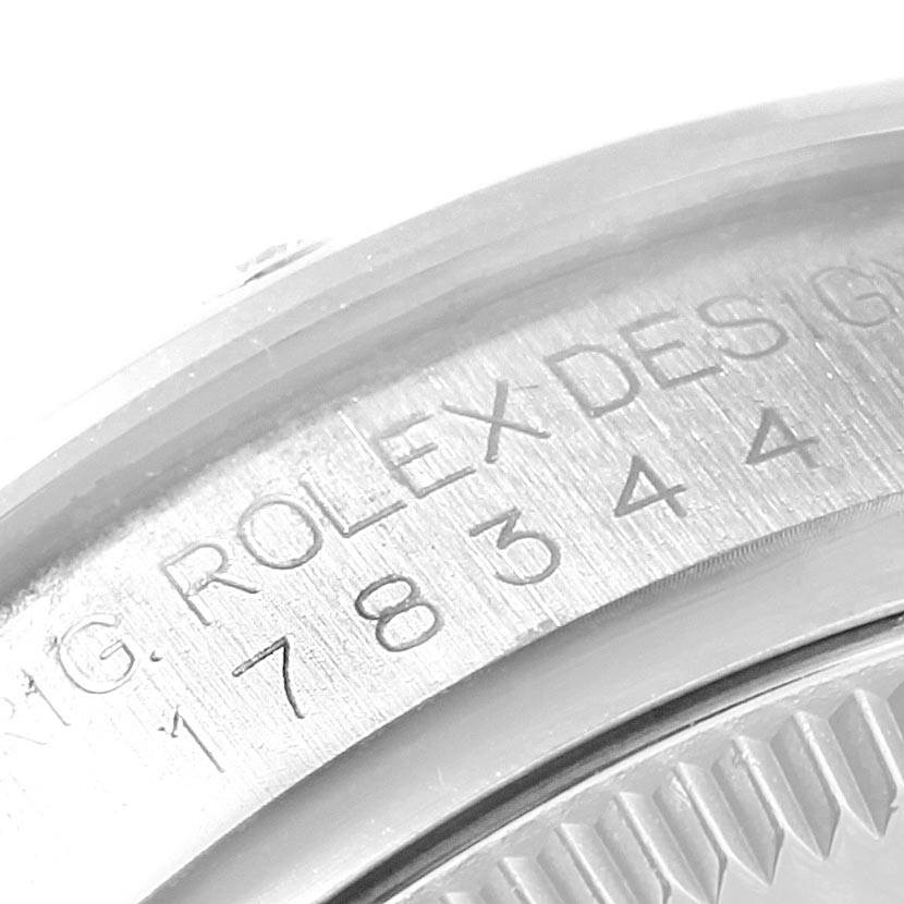 This image shows a close-up of the Rolex Mid-Size 178344 Women's Stainless Steel Mother of Pearl Dial 178344 Women's Stainless Steel Mother of Pearl Dial model's caseback with visible engravings.