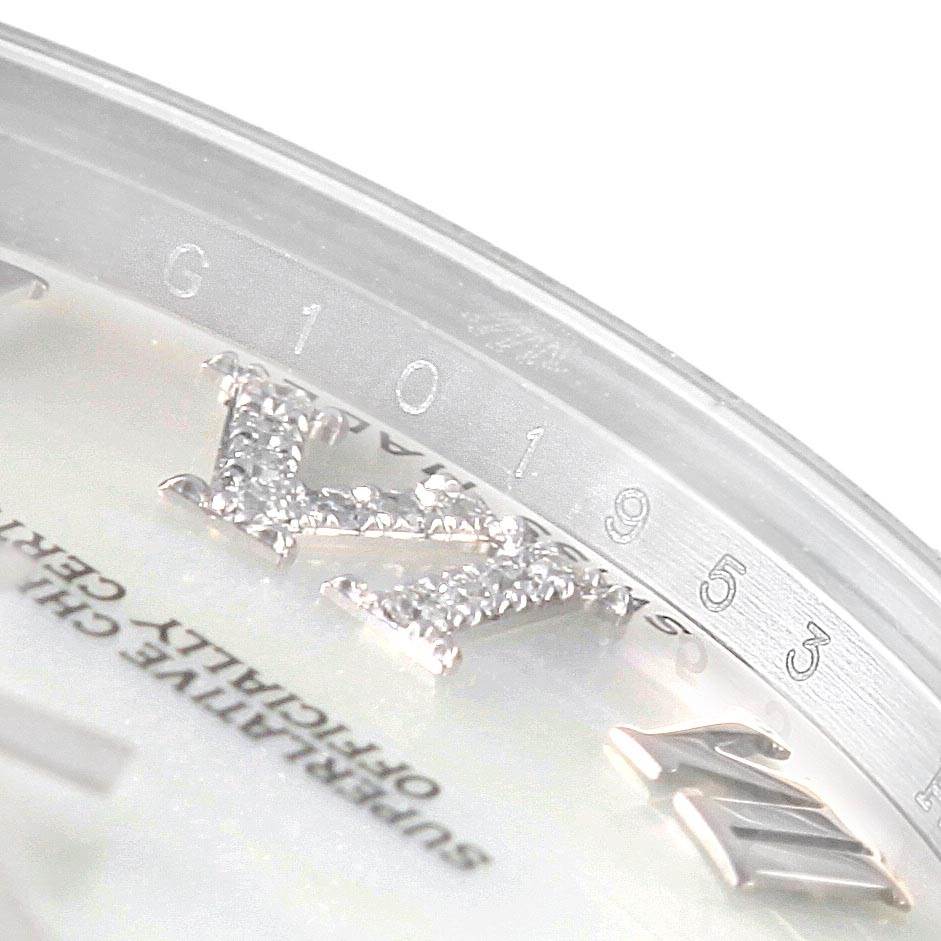 The image shows a close-up of the dial and bezel of a Mid-Size Rolex watch.