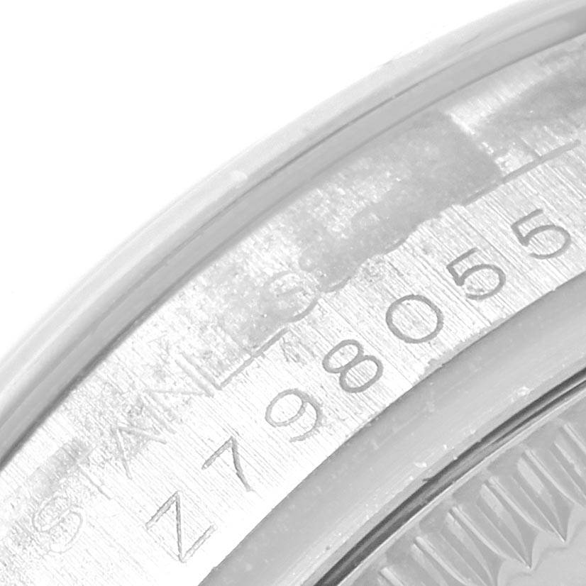 The image shows a close-up of the serial number engraved on the case of a Rolex Mid-Size 178240 Women's Stainless Steel White Dial 178240 Women's Stainless Steel White Dial model watch.