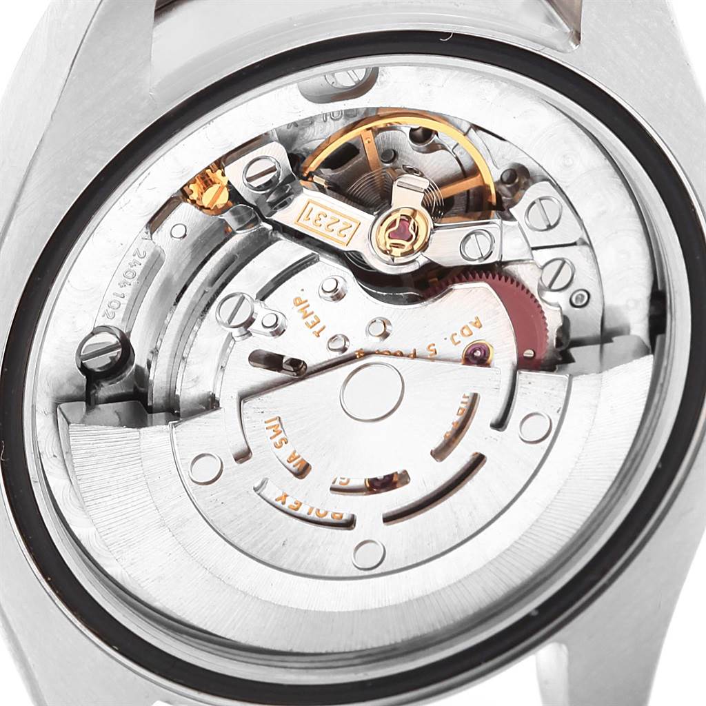 The image shows the internal mechanical movement of a Mid-Size Rolex watch from a rear angle.