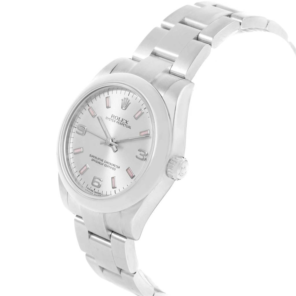 The image shows a Rolex Oyster Perpetual Mid-Size watch at a front angle, highlighting the dial, bezel, and bracelet.