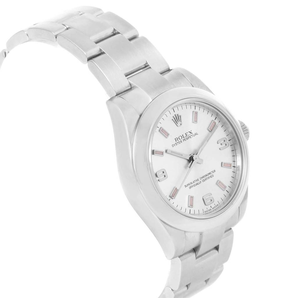 This image shows the Rolex Mid-Size 177200 Women's Stainless Steel Silver Dial 177200 Women's Stainless Steel Silver Dial Oyster Perpetual watch at a slight angle, highlighting its face, bezel, and part of the bracelet.