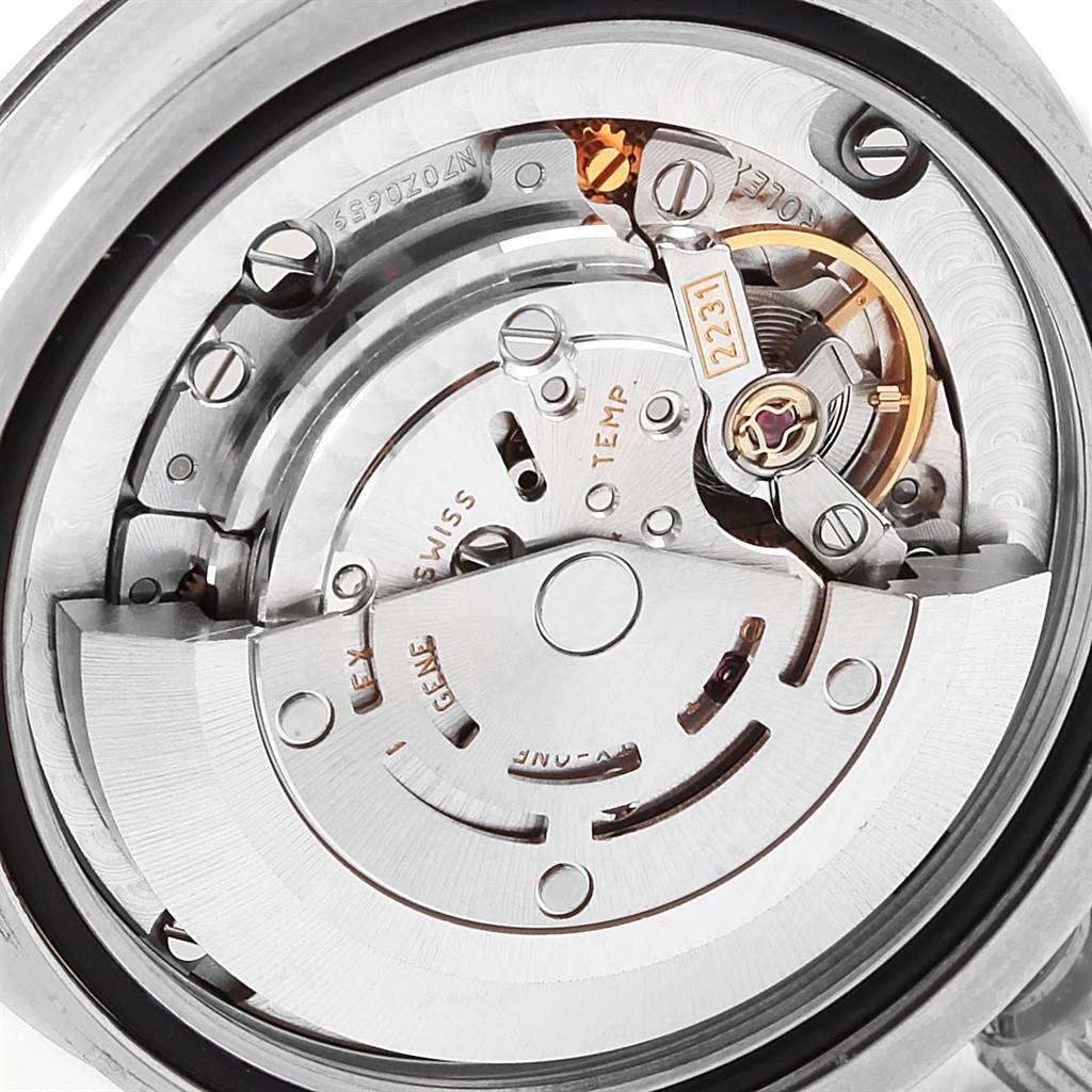 This image shows the intricate internal mechanism and movement parts of a Mid-Size Rolex watch from a rear angle.