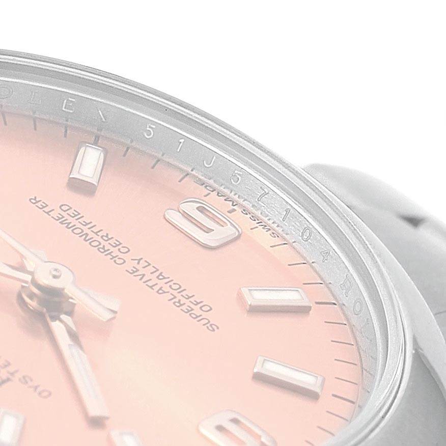 This image shows a close-up view of the dial and bezel of a Mid-Size Rolex watch.