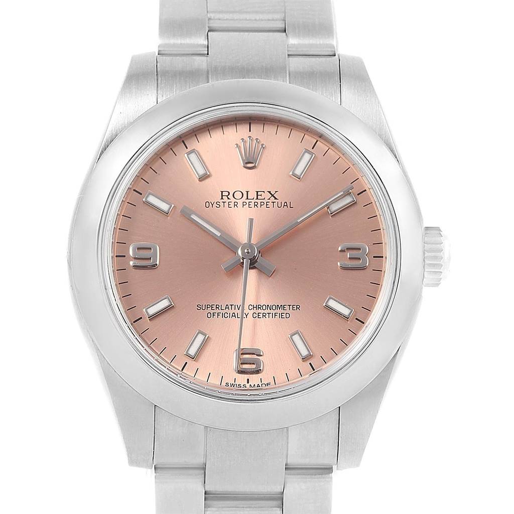 The image shows a front view of a Rolex Oyster Perpetual Mid-Size watch featuring a pink dial and a stainless steel bracelet.