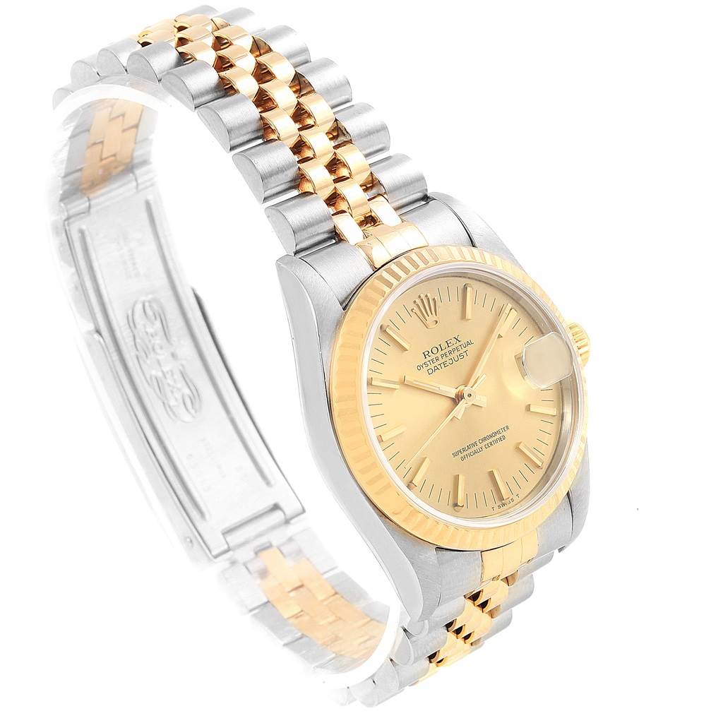 This image shows a side angle of a Rolex Mid-Size 68273 Women's Steel and Gold (two tone) Champagne Dial 68273 Women's Steel and Gold (two tone) Champagne Dial Datejust, highlighting its two-tone bracelet and gold dial.