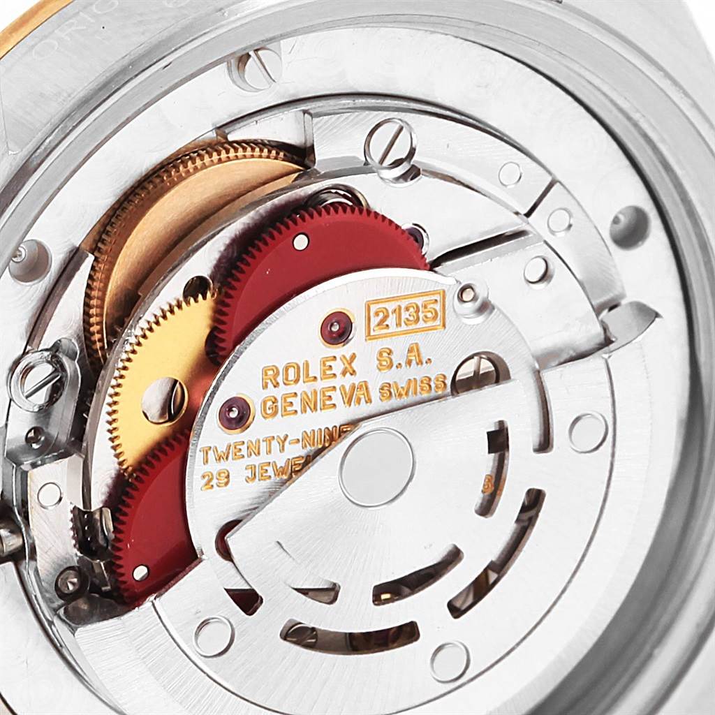 The image shows an internal view of the Rolex Mid-Size 68273 Women's Steel and Gold (two tone) Champagne Dial 68273 Women's Steel and Gold (two tone) Champagne Dial model, focusing on its mechanism and gears.