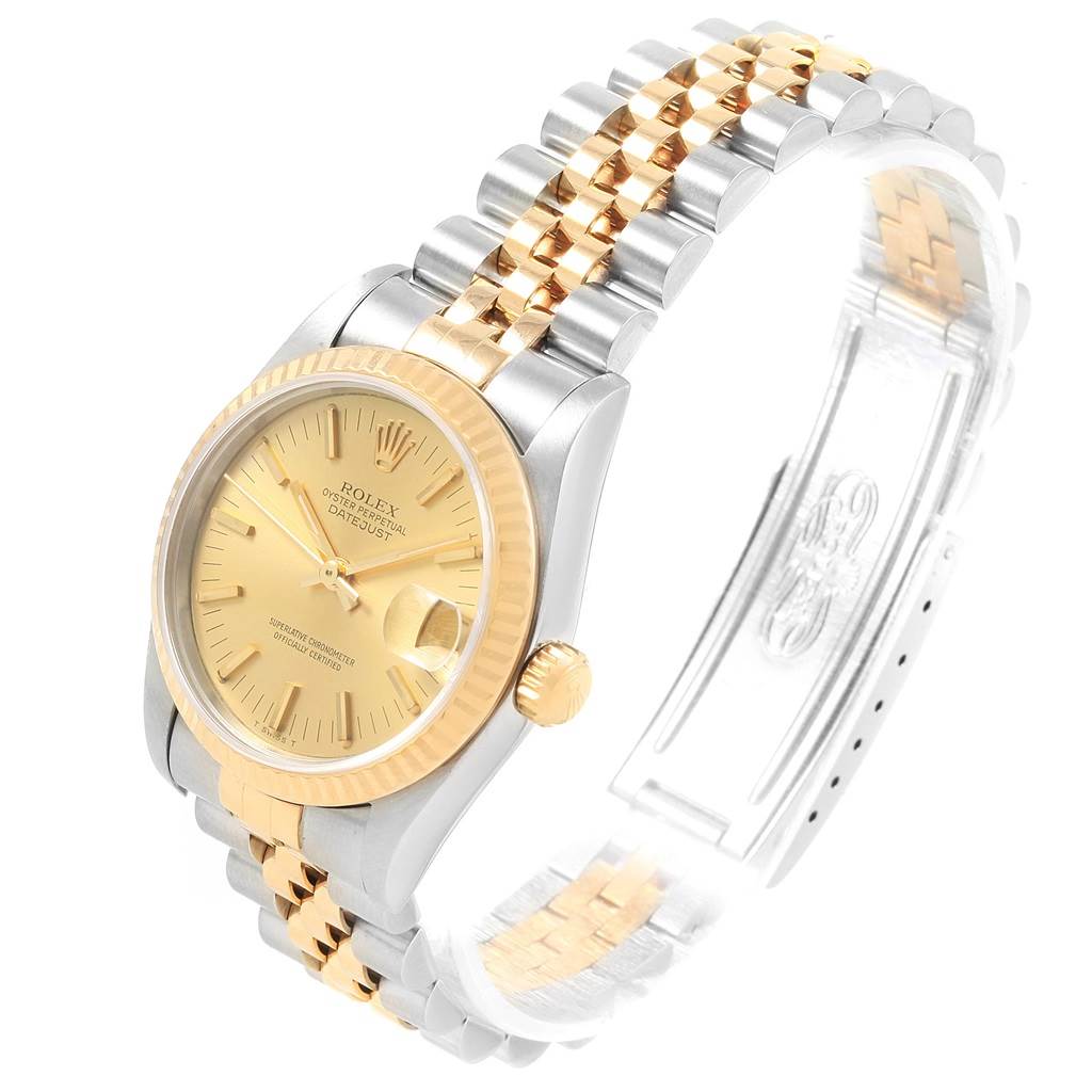 The image shows a Rolex Mid-Size 68273 Women's Steel and Gold (two tone) Champagne Dial 68273 Women's Steel and Gold (two tone) Champagne Dial Datejust watch at an angled side view, highlighting its gold and silver band and dial.