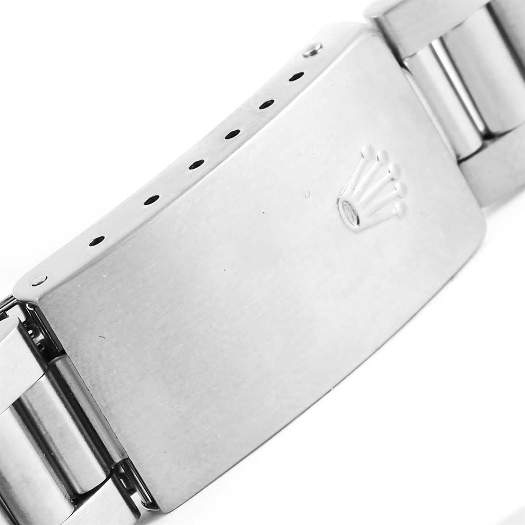 This image shows a close-up of the clasp and part of the bracelet of a Rolex Mid-Size 77080 Women's Stainless Steel Blue Dial 77080 Women's Stainless Steel Blue Dial model.