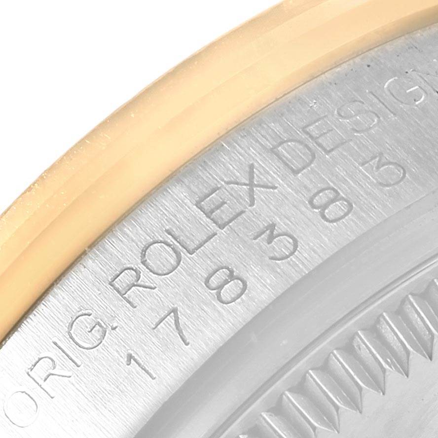 The image shows a close-up view of the engraved text on the bezel of a Rolex Mid-Size 178383 Women's Steel and Gold (two tone) Silver Dial 178383 Women's Steel and Gold (two tone) Silver Dial watch.