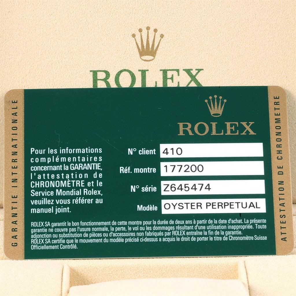 This image shows a close-up of a green Rolex warranty card for the Mid-Size Oyster Perpetual model with reference number 177200.