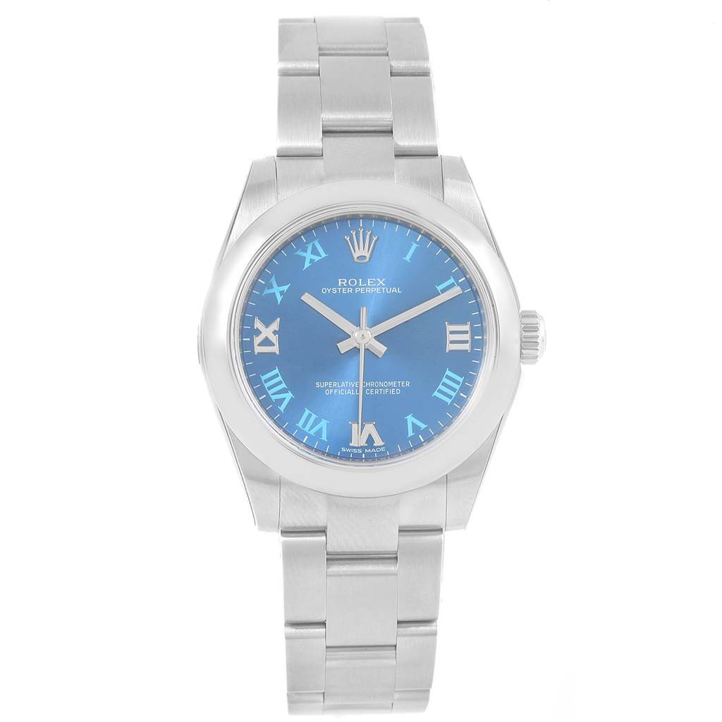 The image shows a front view of a Rolex Oyster Perpetual Mid-Size watch with a blue dial and Roman numerals.
