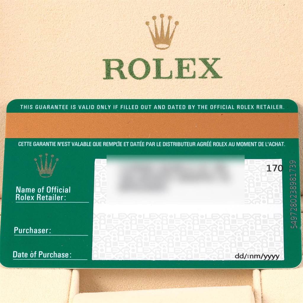 The image shows a Rolex guarantee card on beige background, featuring the Rolex logo and warranty details for a Mid-Size model. 