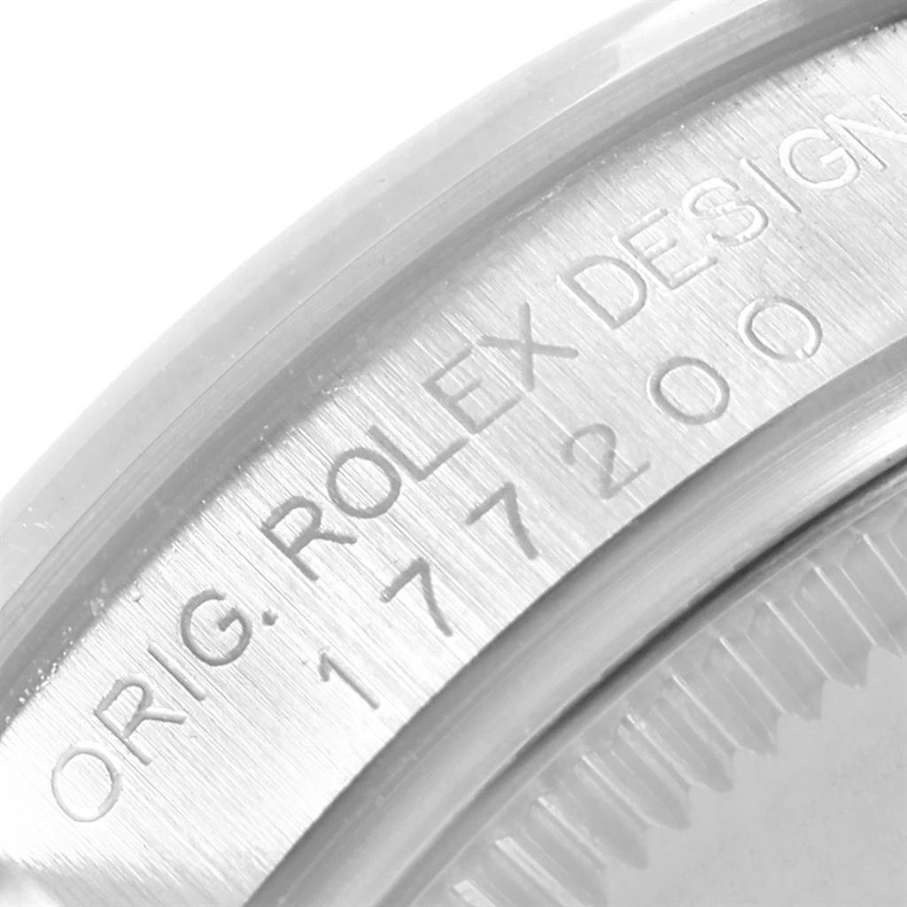 This image shows a close-up of the case side with the engraved model number of a Mid-Size Rolex watch.
