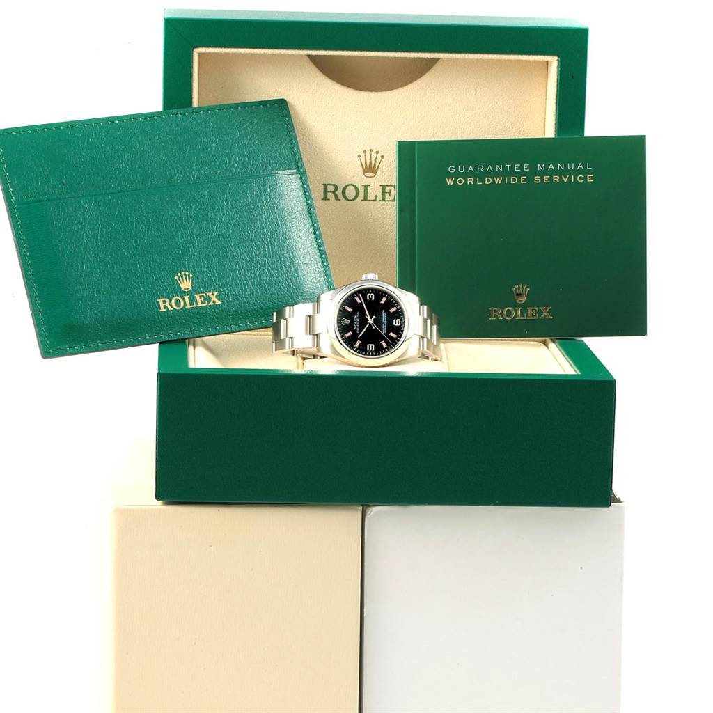 The image shows a Rolex Mid-Size 177200 Women's Stainless Steel Black Dial 177200 Women's Stainless Steel Black Dial watch in its open box with guarantee manual and cardholder.