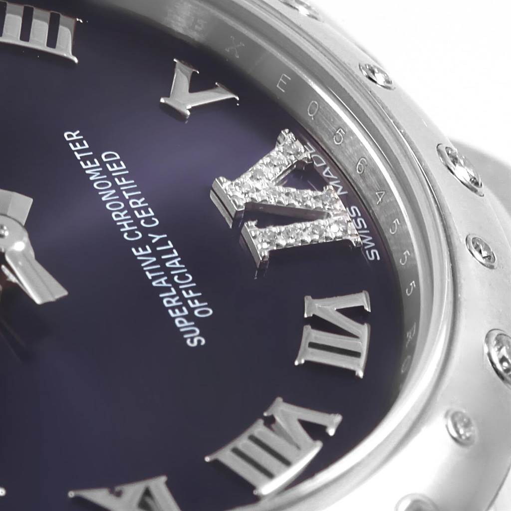 This close-up angle shows the dial, bezel, and Roman numeral markers of the Rolex Mid-Size 178344 Women's Stainless Steel Purple Dial 178344 Women's Stainless Steel Purple Dial watch.