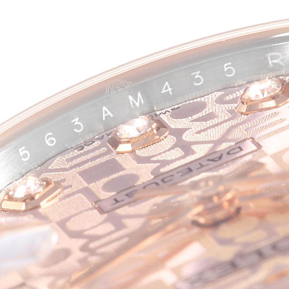 This close-up angle of the Rolex Mid-Size 178271 Women's Steel and Gold (two tone) Pink Dial 178271 Women's Steel and Gold (two tone) Pink Dial watch shows the dial, including diamonds and the "DATEJUST" label.