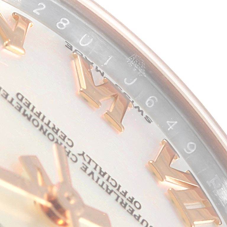 This image shows a close-up of the Rolex Mid-Size 178271 Women's Steel and Gold (two tone) Mother of Pearl Dial 178271 Women's Steel and Gold (two tone) Mother of Pearl Dial watch dial, highlighting the Roman numerals and part of the outer ring.