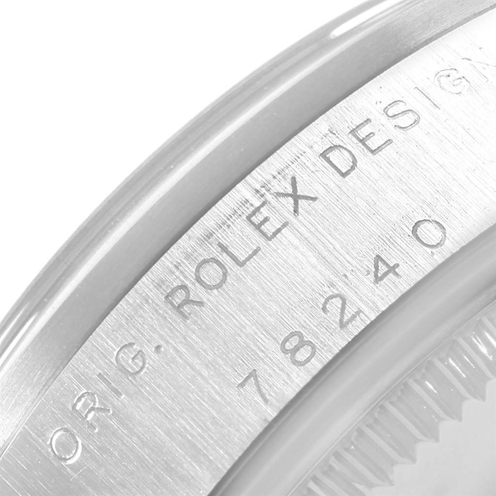 This image shows a close-up angle of the case with "Rolex 78240 Men's Stainless Steel Pink Dial 78240 Men's Stainless Steel Pink Dial" branding and the model number 78240 on the Rolex 78240 Men's Stainless Steel Pink Dial 78240 Men's Stainless Steel Pink Dial Datejust 31 Midsize watch.