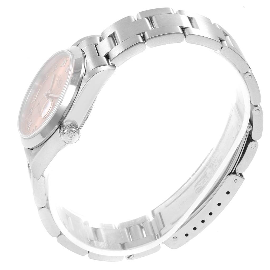 The Rolex 78240 Men's Stainless Steel Pink Dial 78240 Men's Stainless Steel Pink Dial Datejust 31 Midsize 78240 Ladies Watch is shown in a side angle, featuring its salmon Roman dial and metal bracelet.