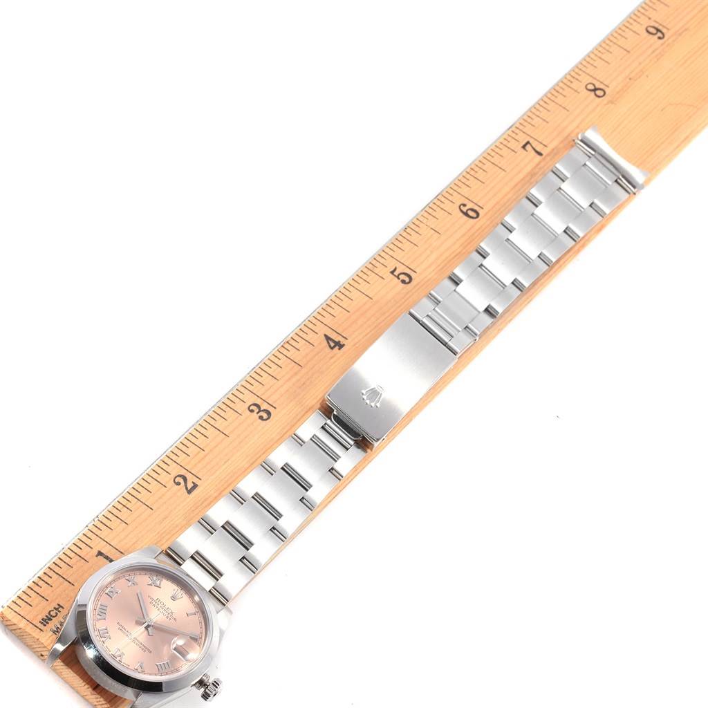 This image shows a top-down view of the Rolex 78240 Men's Stainless Steel Pink Dial 78240 Men's Stainless Steel Pink Dial Datejust 31 Midsize Salmon Roman Dial Ladies Watch 78240, including the face, band, and clasp.