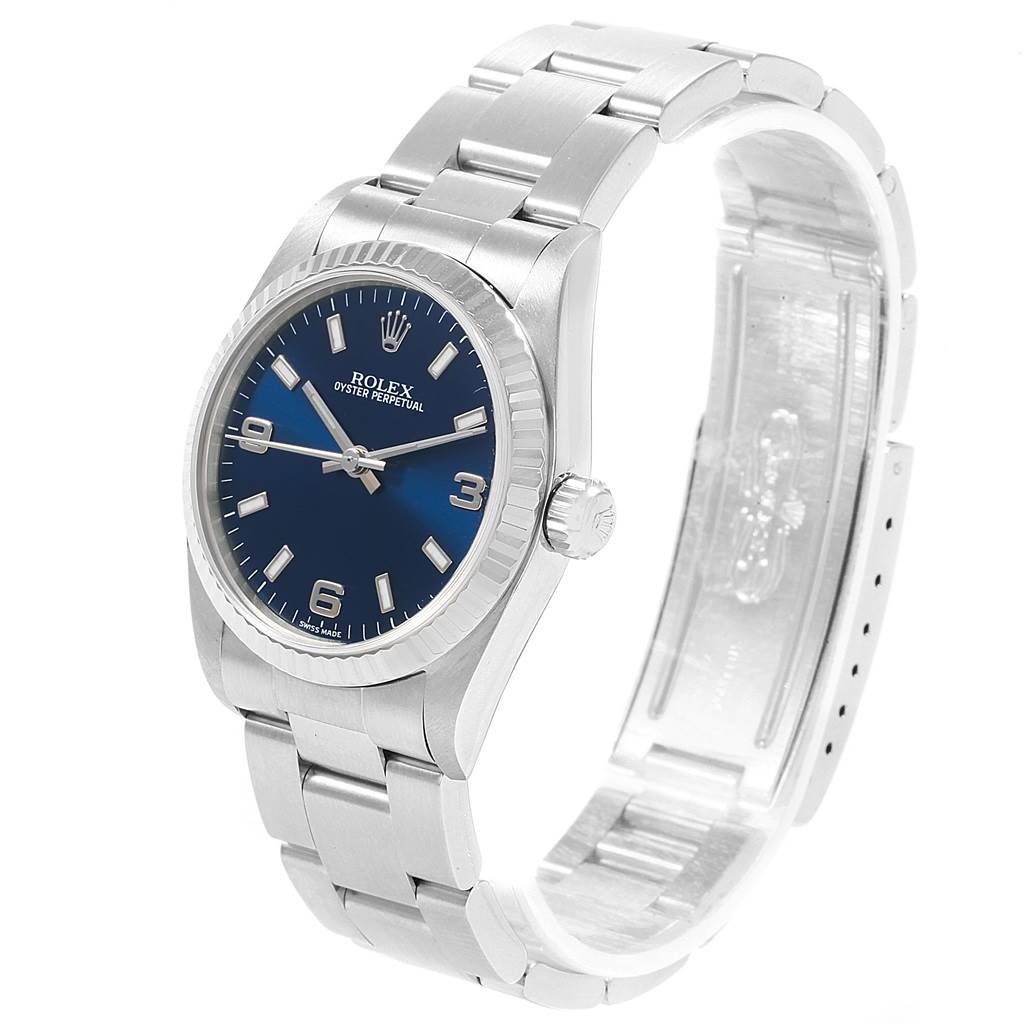 The image shows a Mid-Size Rolex Oyster Perpetual watch at a 3/4 angle, highlighting the dial, bezel, bracelet, and clasp.