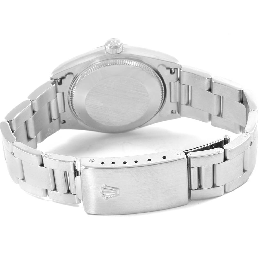 This image shows the back view of a Rolex Mid-Size 77014 Women's Stainless Steel Blue Dial 77014 Women's Stainless Steel Blue Dial model watch, highlighting the case back and clasp.