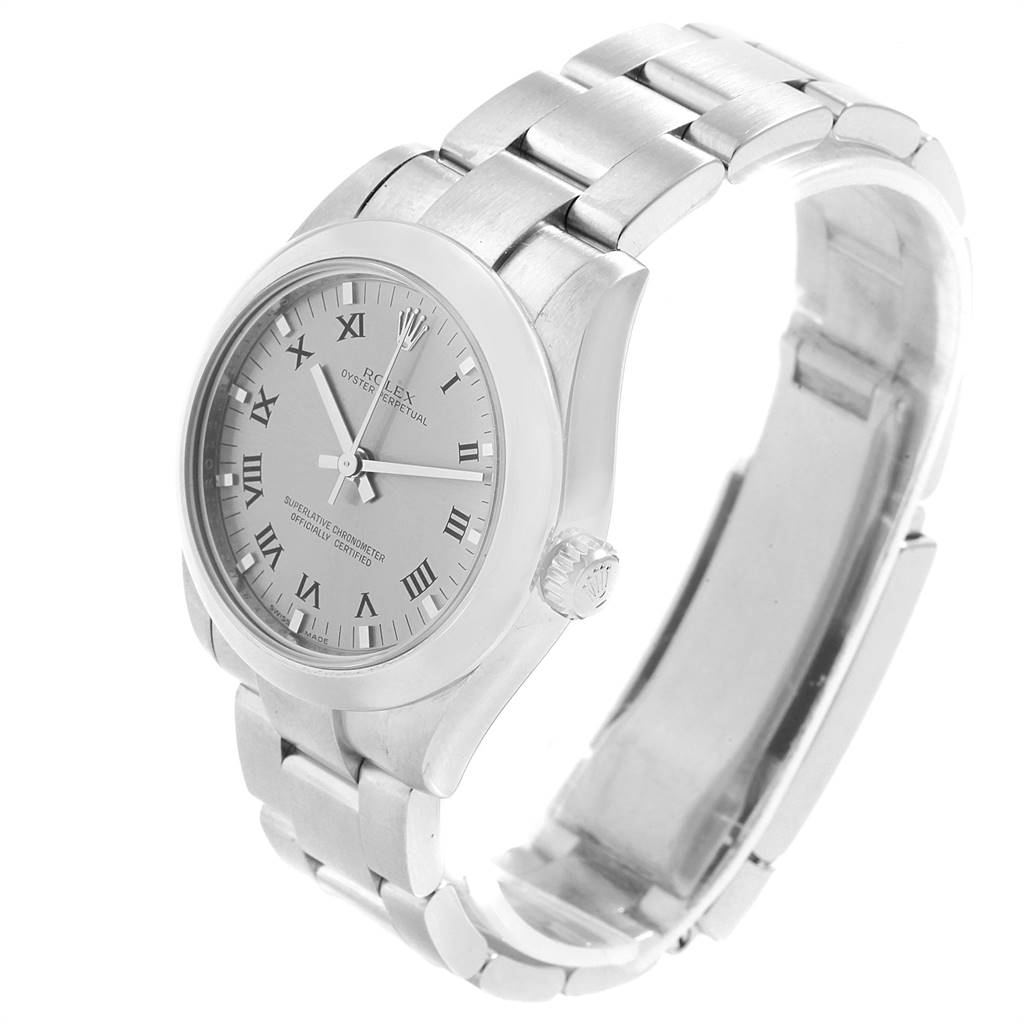 This image shows a side angle of the Rolex Oyster Perpetual Mid-Size watch, highlighting the dial, bezel, crown, and bracelet.