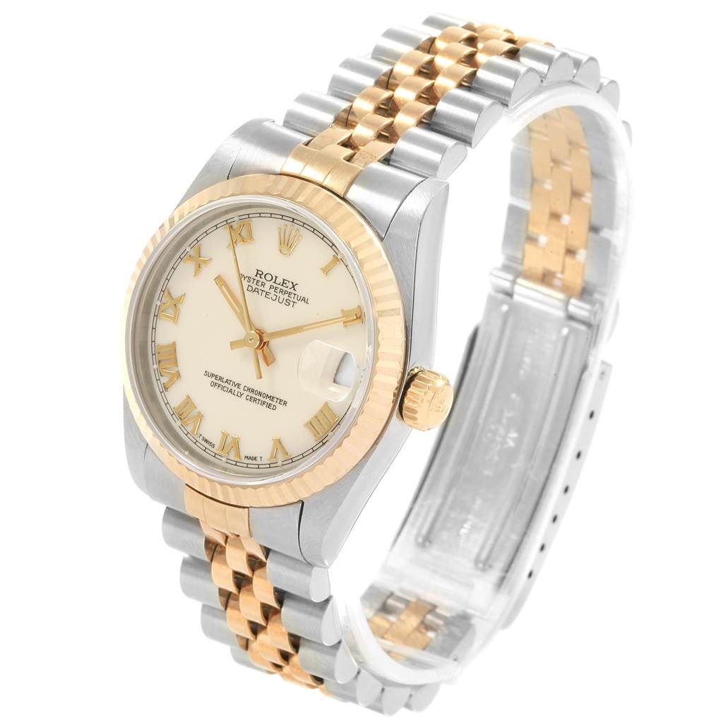 The image shows a Rolex Mid-Size 68273 Women's Steel and Gold (two tone) Beige Dial 68273 Women's Steel and Gold (two tone) Beige Dial Datejust watch at an angled view, displaying its face, bezel, and two-tone metal bracelet.