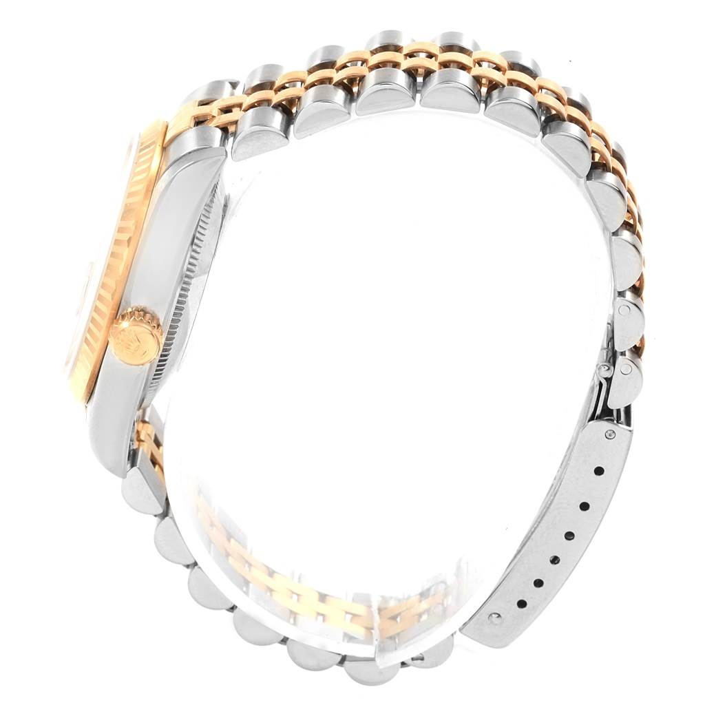 This side view shows the bracelet, crown, and case of a Rolex Mid-Size 68273 Women's Steel and Gold (two tone) Beige Dial 68273 Women's Steel and Gold (two tone) Beige Dial model watch.