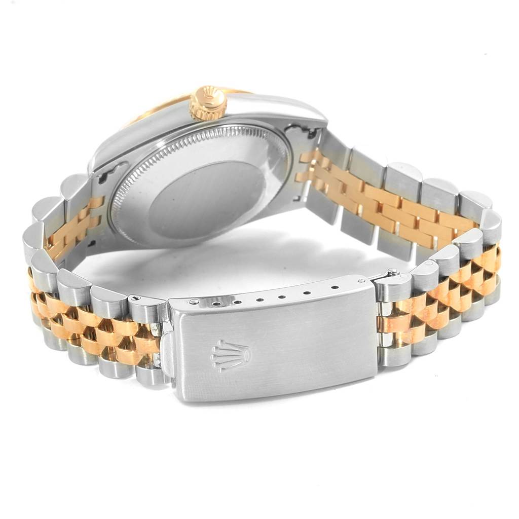 The image shows the back and clasp of a Mid-Size Rolex watch, featuring a two-tone metal bracelet.