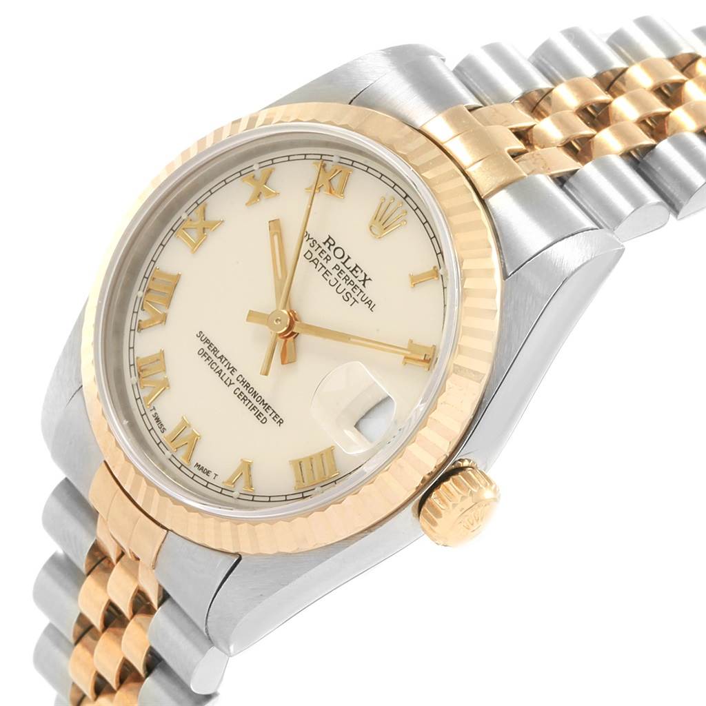 The image shows a Rolex Mid-Size 68273 Women's Steel and Gold (two tone) Beige Dial 68273 Women's Steel and Gold (two tone) Beige Dial Datejust watch angled from the top left, highlighting the face, bezel, crown, and part of the bracelet.